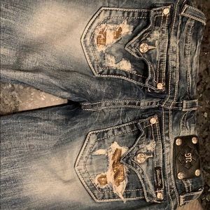 Signature rised cuff skinny distressed jeans